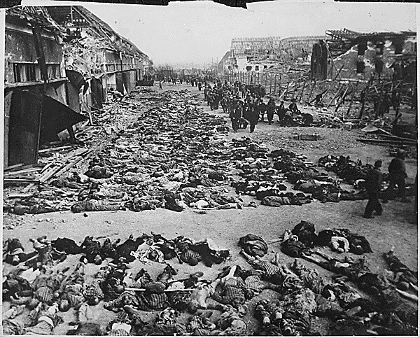 Rows_of_bodies_of_dead_inmates_fill_the_yard_of_Lager_Nordhausen%2C_a_Gestapo_concentration_camp.jpg